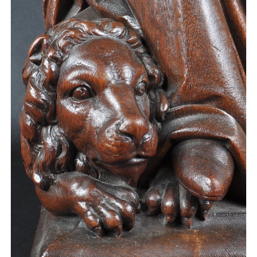 119 - A 20th century carved seated statue of Saint Jerome. An ornately carved with fine detailing, posed s... 