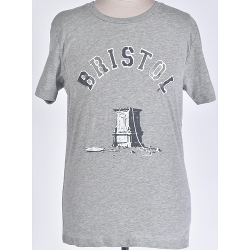 44 - Banksy (British b. 1974)
 Colston, 2021
 Stencil print on shirt
 Size S

 Banksy is a pseudonymous E... 