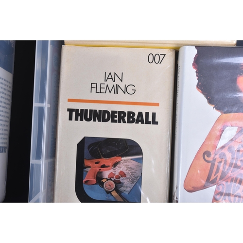 19 - A large collection of assorted James Bond related vintage books.  Titles to include: Colonel Sun by ... 