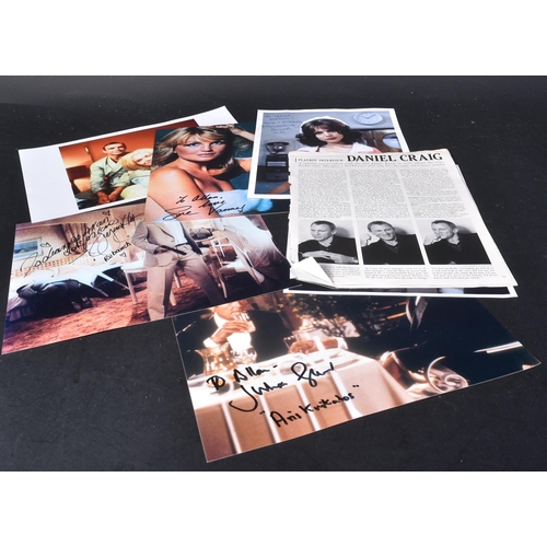 23 - A collection of James Bond related autographed photographs.  Autographs to include: Madeline Smith, ... 