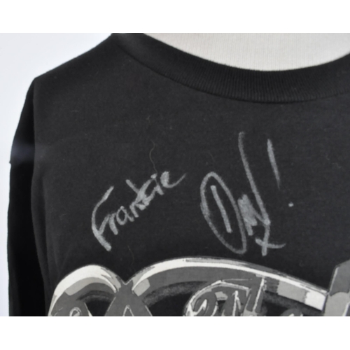 266 - The Darkness - an autographed t-shirt by the band, including Justin and Dan Hawkins. All signed in s... 