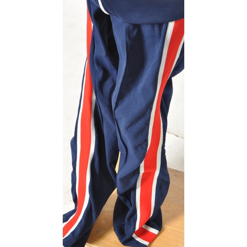 325 - The Who - Keith Moon - Moon's personally owned and worn 1970s tour tracksuit. Blue, with red and whi... 