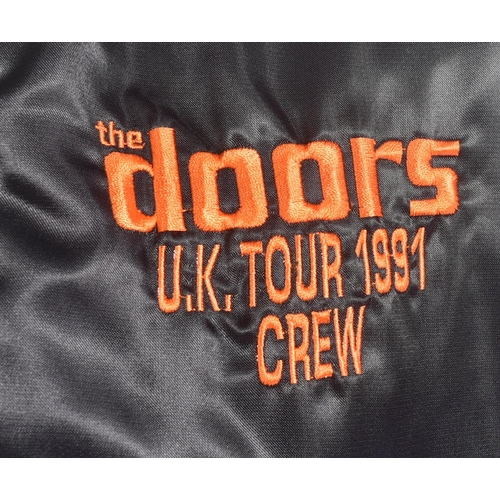 53 - The Doors - A 1990s The Doors UK Tour black satin jacket, issued to promote the biopic movie The jac... 