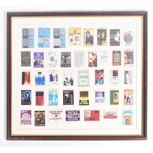 90 - Music Memorabilia - Backstage Passes - a large framed display of assorted backstage passes from vari... 