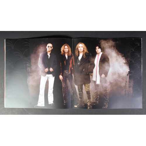 92 - The Darkness - an autographed tour programme by the band, including Justin and Dan Hawkins. All sign... 