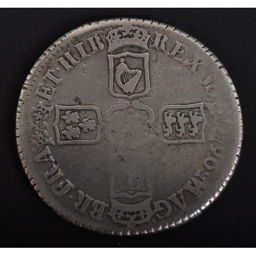 1116 - A 1696 William III silver crown having the Monarch in profile to the obverse and shield / four count... 