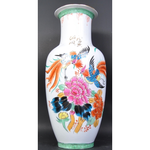 613 - A large 20th century Chinese famille rose floor vase. White ground with famille rose decoration to t... 