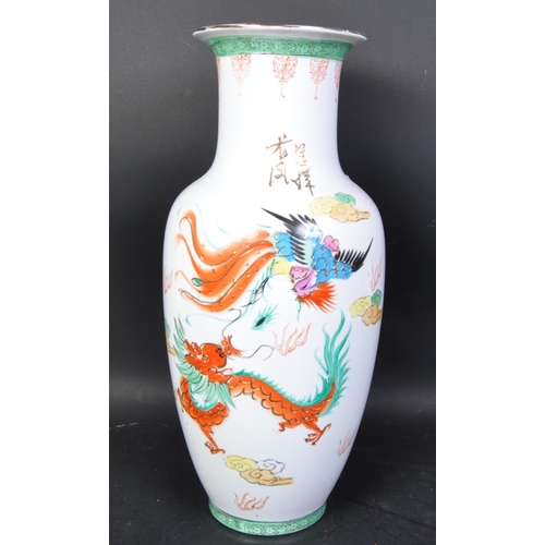 613 - A large 20th century Chinese famille rose floor vase. White ground with famille rose decoration to t... 