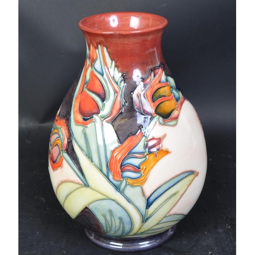 626 - A vintage late 20th century circa 1991 Moorcroft pottery 'Tulip' vase having a bulbous shaped body w... 