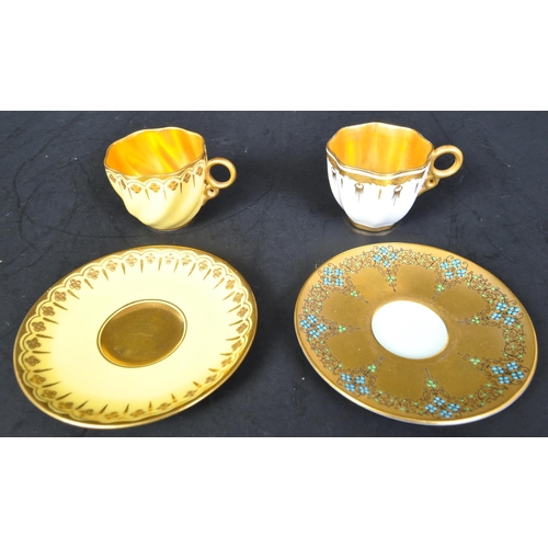 635A - Two early 20th century Coalport & Royal Worcester porcelain coffee cups & saucers. The lot to includ... 