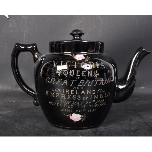 637 - An assorted collection of 19th century and later ceramics to include a commemorative black teapot ce... 