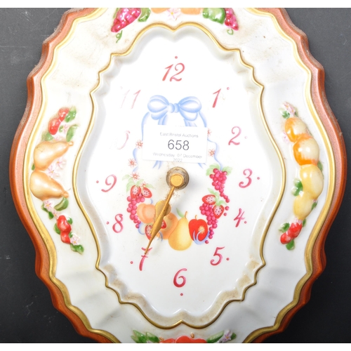 658 - A vintage 20th century Franklin Mint ceramic wall clock being hand painted with gilding and fruits, ... 