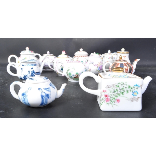 660 - A collection of Victoria and Albert Museum bone china tea pots to include Chelsea-Derby, Chinese, Ve... 