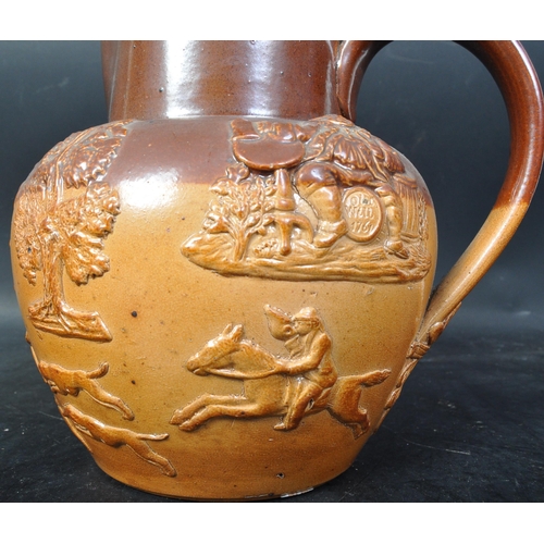 662 - A Victorian 19th century Royal Doulton stoneware Harvest jug with silver mounted rim and lid of bulb... 