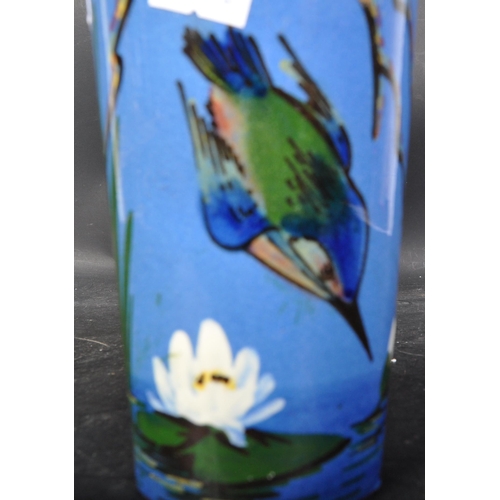 665 - A vintage 20th Century pottery vase. Having a ebonised rim, brown interior with a blue glaze with a ... 