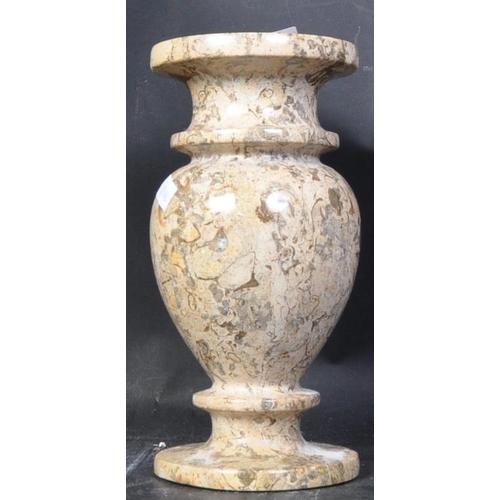 667 - A vintage 20th Century marble vase. Of circular form with a tapering rim bulbous body and round base... 