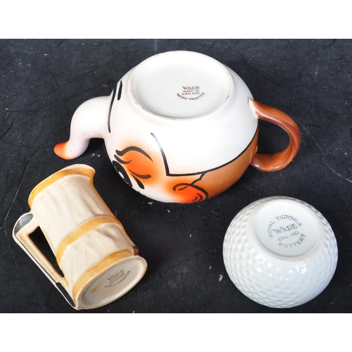 668 - Wade - A vintage 20th century circa. 1950's Wade novelty ceramic Andy Capp Golfer teapot together wi... 