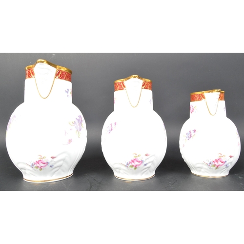 670A - A set of 3 Coalport graduating jugs  - Caughley Mask Head jugs, the originals being produced about 1... 