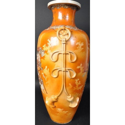 670 - A large 20th century Japanese satsuma ware vase. The vase having Matagi type figures to the body wit... 