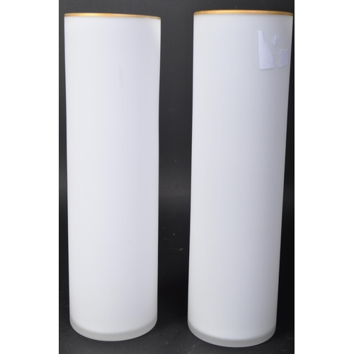 672 - A pair of vintage 20th century Chinese vases. Each being of cylindrical form with frosted glass body... 