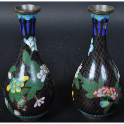 677 - A pair of vintage 20th Century Japanese Cloisonné vases. Having a small rim tapering neck into a rou... 