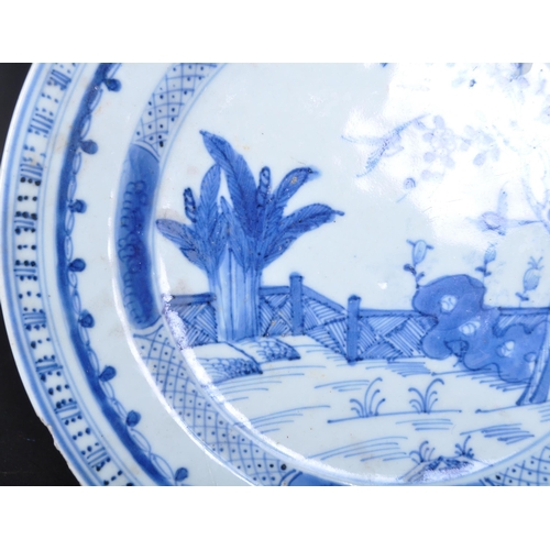 678 - A 19th century Chinese blue and white porcelain plate being hand painted with rural scene featuring ... 