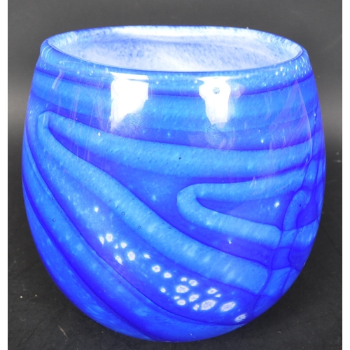 685A - A vintage 20th Century signed studio art glass vase. In blue colourway with a bulbous body. Signed W... 