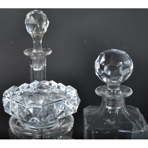 688 - A collection of five vintage 20th century cut glass decanters. The collection to include a Stuart Cr... 