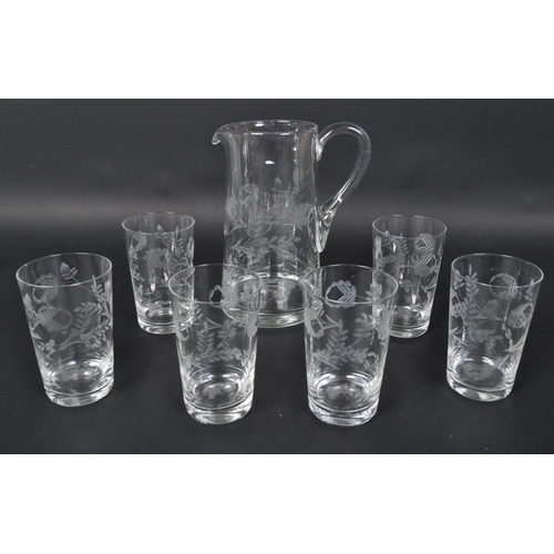 699 - A vintage 20th Century acid etched lemonade decanter drinking glass set. Comprising of a decanter ju... 