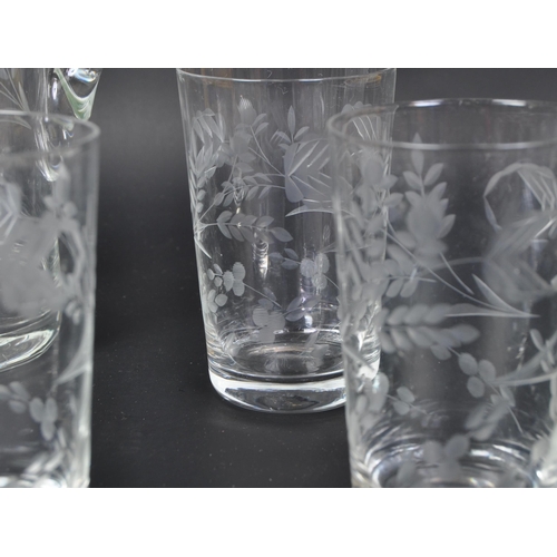 699 - A vintage 20th Century acid etched lemonade decanter drinking glass set. Comprising of a decanter ju... 