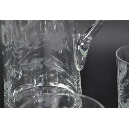 699 - A vintage 20th Century acid etched lemonade decanter drinking glass set. Comprising of a decanter ju... 