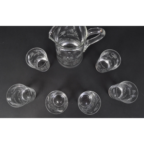 699 - A vintage 20th Century acid etched lemonade decanter drinking glass set. Comprising of a decanter ju... 