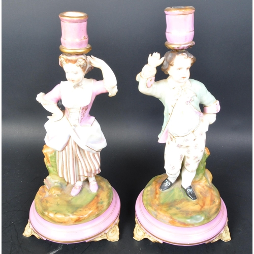 700A - Pair of 19th century Parisien French porcelain candlesticks. Pink ground and gilt flashwork socles w... 