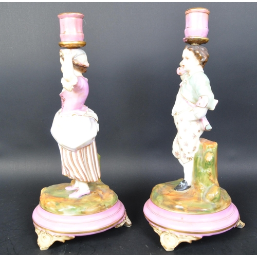 700A - Pair of 19th century Parisien French porcelain candlesticks. Pink ground and gilt flashwork socles w... 