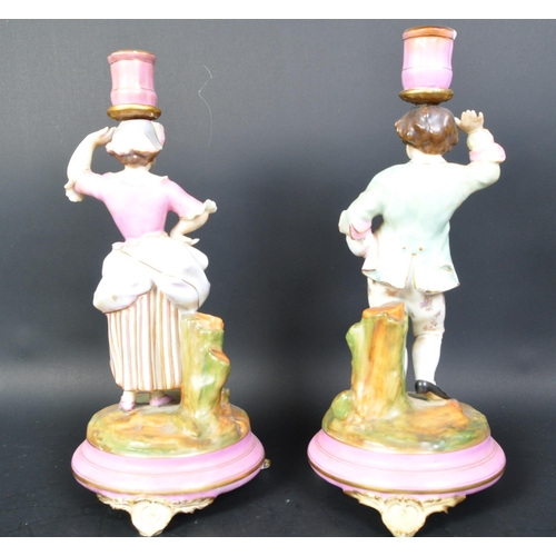 700A - Pair of 19th century Parisien French porcelain candlesticks. Pink ground and gilt flashwork socles w... 