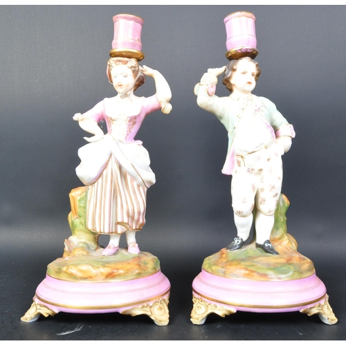 700A - Pair of 19th century Parisien French porcelain candlesticks. Pink ground and gilt flashwork socles w... 