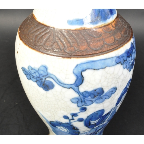 710A - An early 20th century crackle glaze Chinese Oriental vase decorated with blue and white figural scen... 