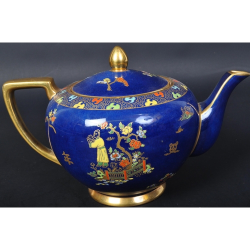 719 - Carlton Ware - A vintage 20th century Carlton ware teapot. The teapot having a cobalt ground with gi... 