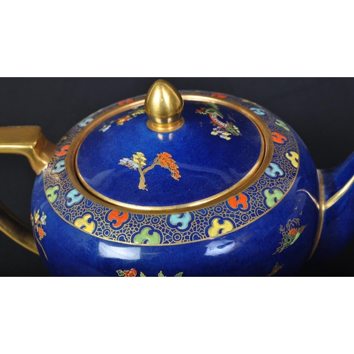 719 - Carlton Ware - A vintage 20th century Carlton ware teapot. The teapot having a cobalt ground with gi... 