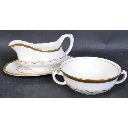 747 - A Bristol Pottery early 20th century porcelain dinner service with cream ground and gilded colourway... 