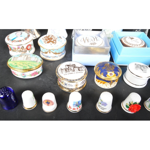 750 - A collection of porcelain and enamel pill boxes to include Buckingham Palace, Royal Mint,  Royal Wor... 