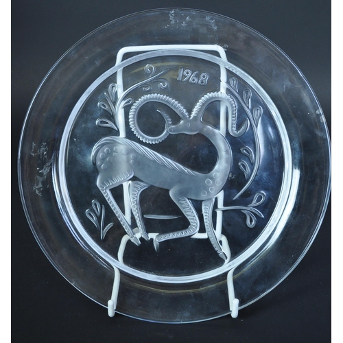 753 - A 1968 Lalique Christmas plate of circular form decorated with scene of gazelle. Engraved Lalique Fr... 