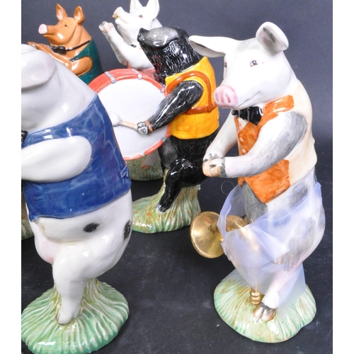 754A - A collection of eight Beswick Pig Prom porcelain figurines to include Matthew, Daniel, Christopher, ... 