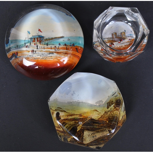 766 - A collection of vintage 20th Century glass tourist place paperweights. To include, Forth bridge, Lla... 