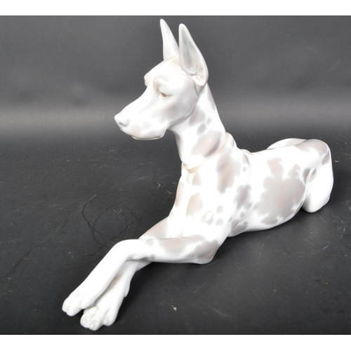 770 - Lladro - Spanish hand made porcelain - A figurine statue of a Great Dane dog in the lying down posit... 