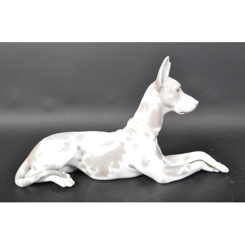 770 - Lladro - Spanish hand made porcelain - A figurine statue of a Great Dane dog in the lying down posit... 