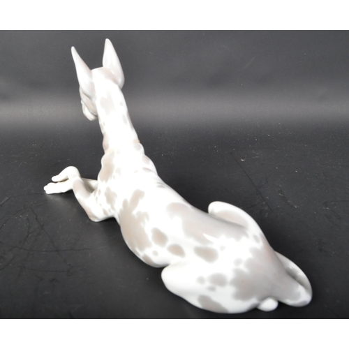 770 - Lladro - Spanish hand made porcelain - A figurine statue of a Great Dane dog in the lying down posit... 