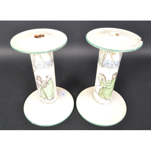 786 - A pair of Royal Doulton series ware ceramic large candle stick holders. (af) Having a lipped top, ha... 