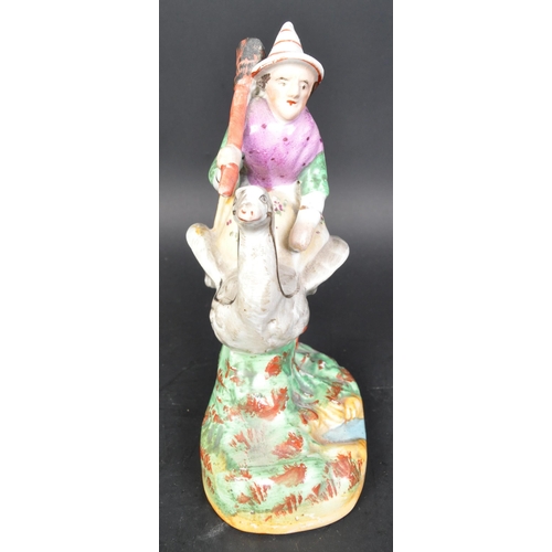 788 - A vintage 19th Century Staffordshire ceramic mother goose statue figurine. Holding a broom riding a ... 