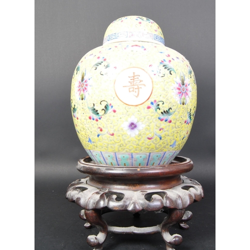 790 - An early 20th Century Chinese Famille Juan lidded ginger jar vase. In a yellow colour way with flora... 